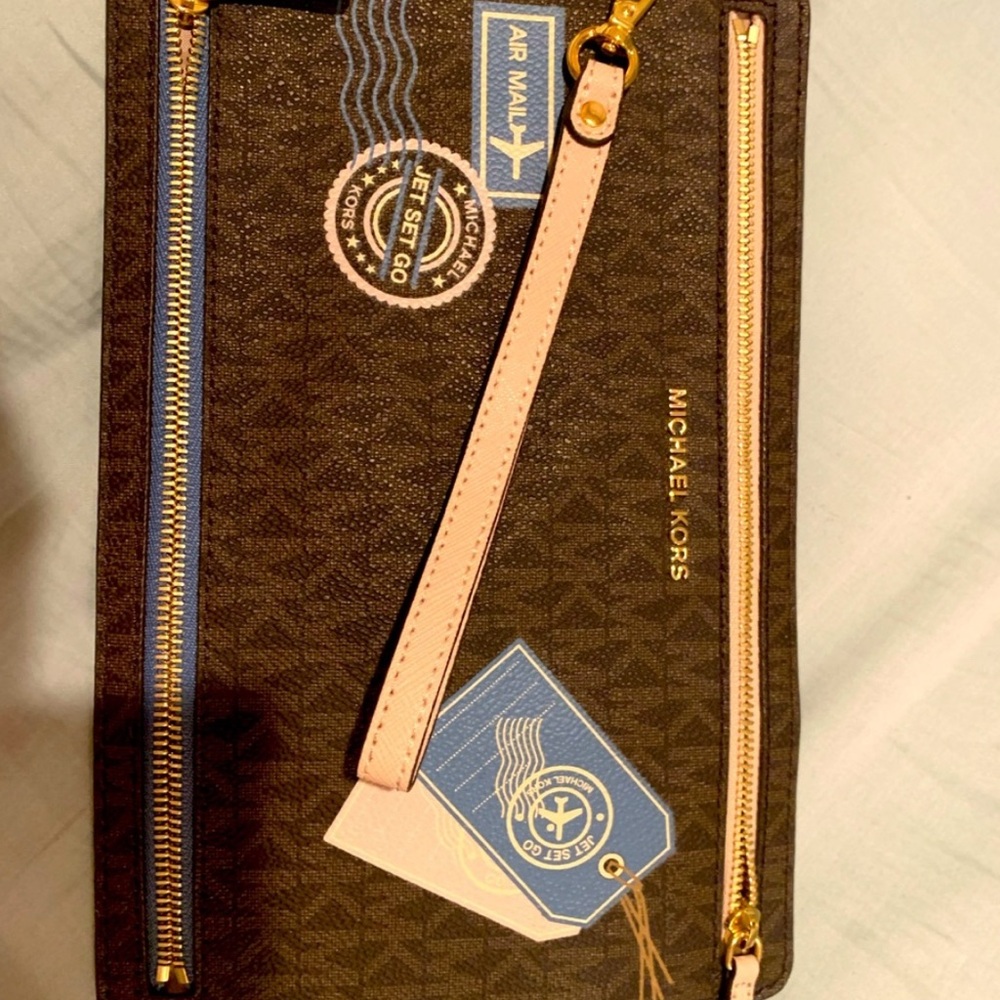 Brand new, limited edition,rare/collective authentic Michael Kors travel pouch.